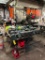assorted PPE: welding hoods, face shields, hard hats, & respirators