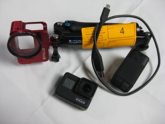 GoPro Camera and pole with charger Red