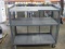 Gray Metal Security Cage on Wheels