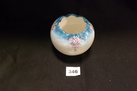 Vase pink flowers on blue background at top