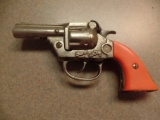 Kenton Hardware 3 ½” barrel cap pistol, orange grip
