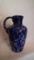 Blue & white splatterware jug with stopper, marked Gibson 1935, 9.5”H x 5”W