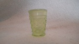 Yellow opalescent with white at the top of shot glass (?), hobnail pattern, 1 7/8”H x 1 3/8”W