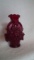Red vase, flowers in a basket design,