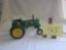 Green plastic tractor with decals to