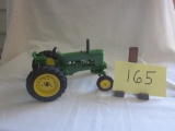 Green plastic tractor with decals to