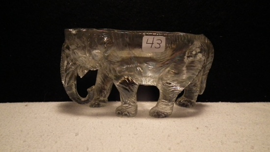 Clear glass elephant, chip at top rim bet/ eye & ear @ left