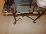 Beveled glass top cocktail table w/ golf club feet