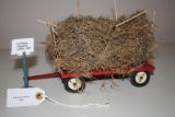 International Harvester wagon w/loose hay and hay forks