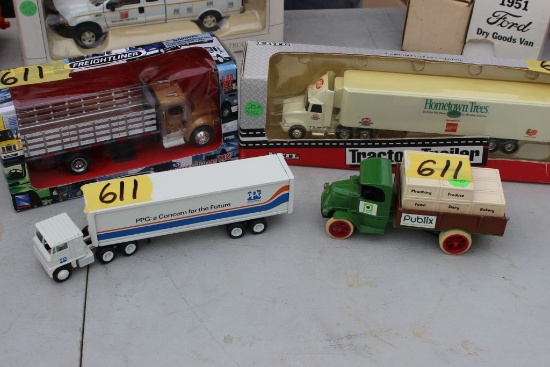 4 scale model trucks, 2 tractor trailer, 2 straight trucks