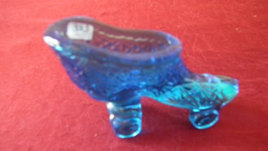 Fenton, clear bright blue skates with star pattern, unmarked, 3” x 4”