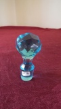 Clear turquoise stopper, tiny air bubbles in top part, 2 3/4” x 1 1/4”