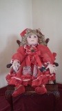 Signed Ashley --------- (unreadable), porcelain, girl doll wearing red Chri