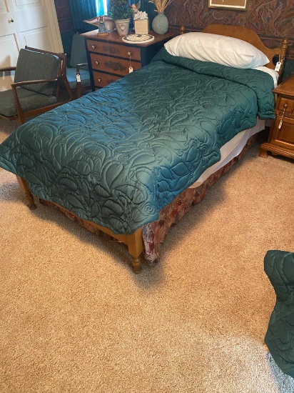 Maple twin bed with mattress, box springs, and bedding