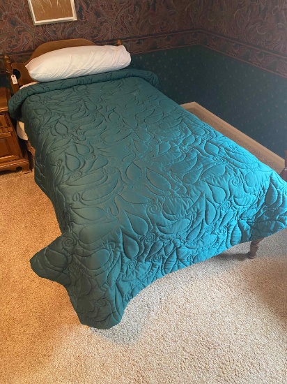 Maple twin bed with mattress, box springs, and bedding