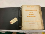 Binder of Massey Ferguson Parts Catalogs
