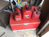 3 Gas Cans and a Coleman Cooler