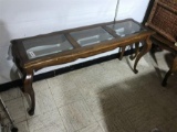 Glass topped wooden table