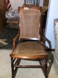 Antique Cane Bottom Rocking Chair Carved