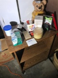 Rolling Shelf in Garage with Items on Top