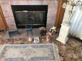 Items in front of fireplace inc. lamp, pedestal