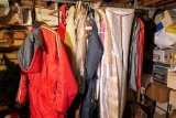Snow Suits and other clothes hanging on rack