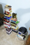 Stacks of assorted books, CD Player