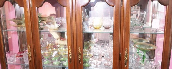 Top two shelves of antique glass in cabinet