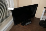 Smaller Sized Flat Screen TV with remote.