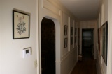 All vintage framed art in hall