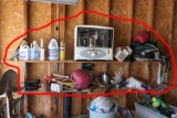 Contents of two shelves in garage inc heater