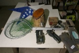 Contents of table top including fishing lures, reels etc