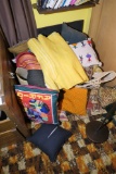 Assorted international pillows, fabrics, basket chest