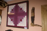 Wood carving of a man + framed quilt piece