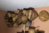Large group of assorted baskets on wall