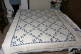 Large sized antique hand stitched blue and white quilt