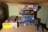 Group of model cars in boxes etc