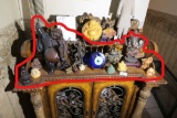 Asian Items and Buddhas on lower level of shelf