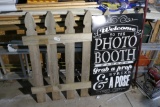 Photo booth sign attached to fence section