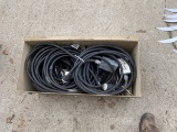 Metal military foot locker filled with extension cords