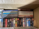 Box of assorted DVDs and CDs