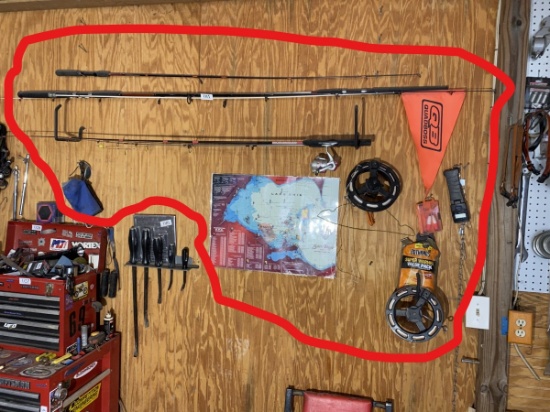 Fishing Poles, reel, assorted fishing related on wall