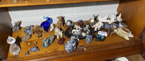 Shelf lot of carvings, figurines inc. Native Canadian made, Goebel terrier