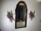 Mirror, sconces, other items on wall