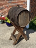 Vintage wine or whiskey barrel on stand