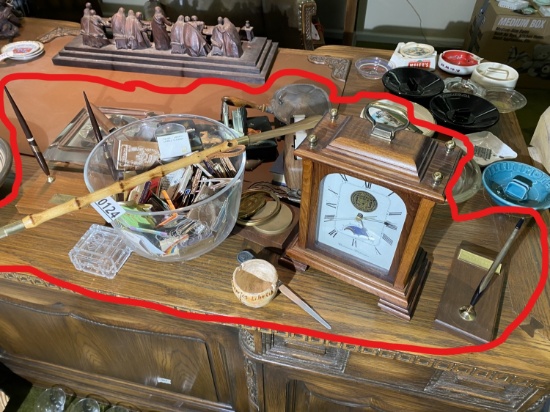 Matches, clock and other items on desk