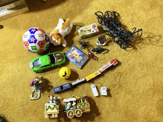Group of assorted items, toys, model trains etc