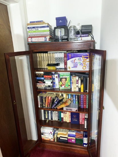 Contents of cabinet, books, tapes, games, tv etc