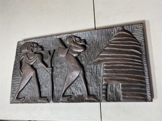 Old African Carved Plaque Figures entering a shelter