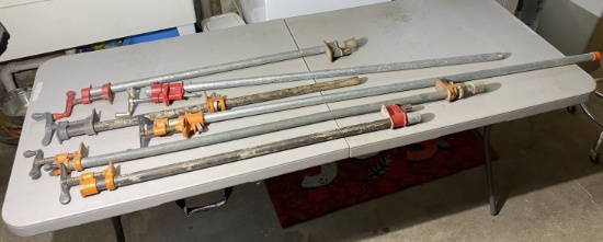 Group of vintage pipe clamps of assorted lengths